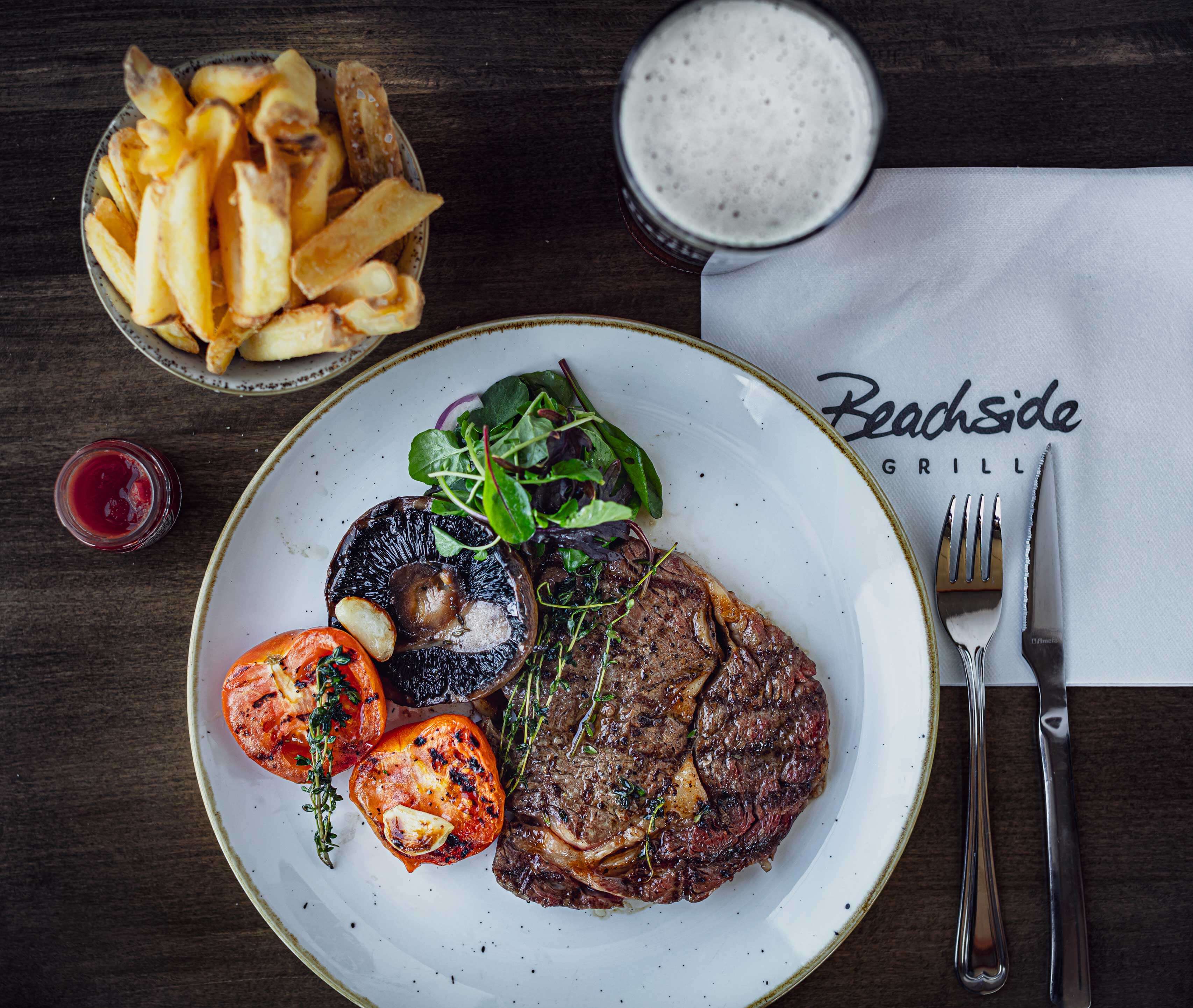 Rib Eye Steak and chips with tomato and mushrooms | Beachside Grill | North Devon